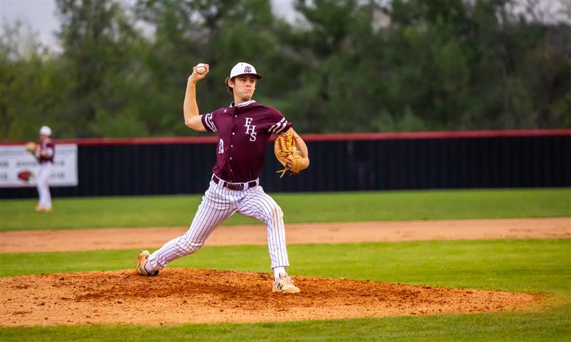 A Franklin High baseball player throws the ball.